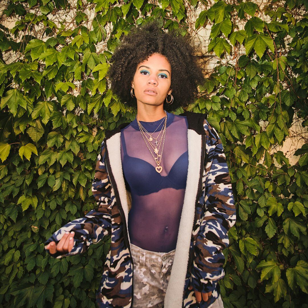 Portrait of a young fashion editor with curly hair and a silk blouse